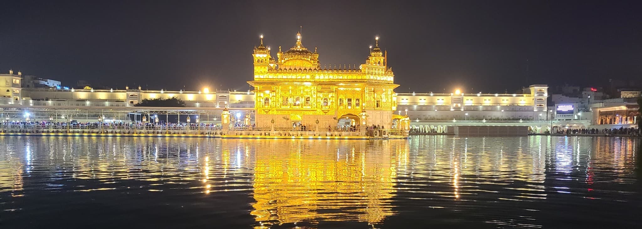Golden Temple illuminated at night.