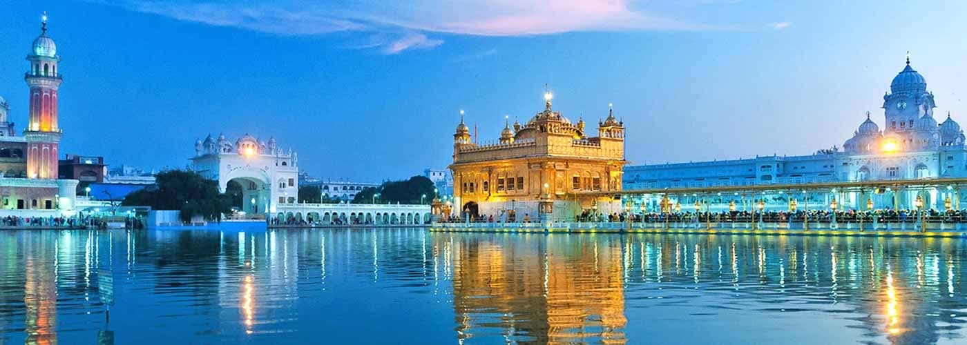 Sri Harmandir Sahib reflected in the sacred sarovar at dusk.